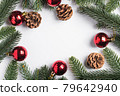 Christmas holidays copy space composition red baubles, pine cones and fir-tree branches. 79642940