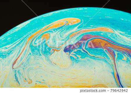 Fluid art made of colorful soap bubble film. Trendy Inkscape blurred background. Alien space planets art. Selective focus. 79642942