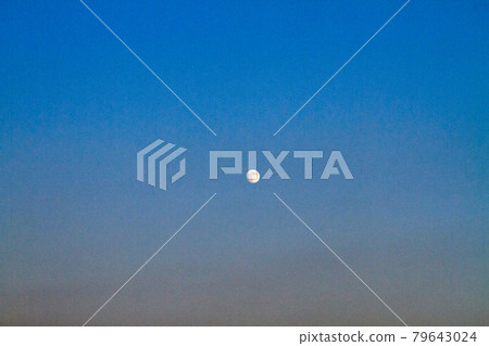 The moon over twilight evening sky background. The moon over twilight evening sky background. 79643024