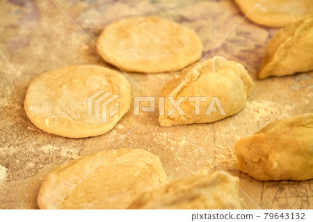 Raw dough tortillas for making sweet cherry turnovers. Raw dough tortillas for making sweet cherry turnovers. 79643132