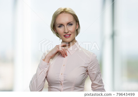 Portrait of beautiful young woman looking at camera. 79643499