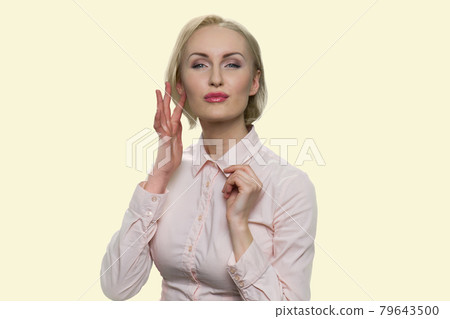 Sexy business woman touching her face. 79643500