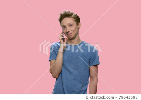 Handsome boy talking on cell phone. 79643595