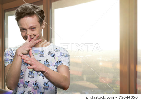 Teenage boy making funny face. 79644056
