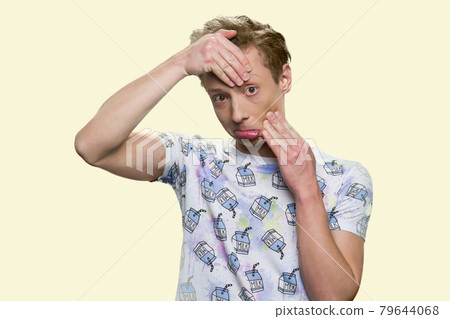 Caucasian teenage boy fooling around. Caucasian teenage boy fooling around. 79644068
