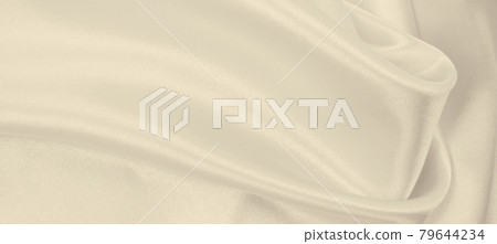 Smooth elegant golden silk or satin luxury cloth texture as wedding background. Luxurious background design. In Sepia toned. Retro style Smooth elegant golden silk or satin luxury cloth texture as wedding background. Luxurious background design. In Sepia toned. Retro style 79644234