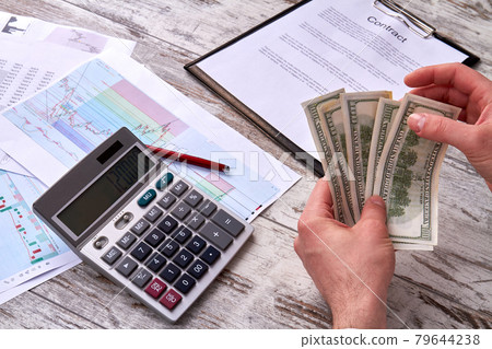 Close up businessman's hands counting dollar banknotes. Close up businessman's hands counting dollar banknotes. 79644238