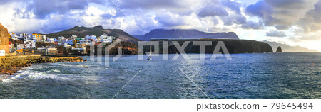 Scenery of Gran Canaria - Puerto de Sardina coastal town over sunset. Canary islands Scenery of Gran Canaria - Puerto de Sardina coastal town over sunset. Canary islands 79645494