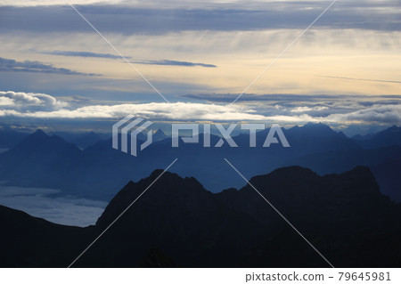 Dramatic morning sky over Mount Stanserhorn and other mountains of the Swiss Alps. 79645981