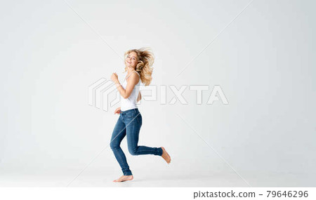 woman in jeans movement dance energy positive fashion woman in jeans movement dance energy positive fashion 79646296