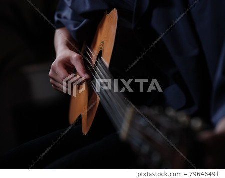 The person who plays the guitar The person who plays the guitar 79646491