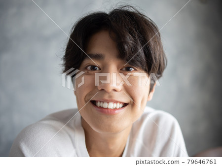 A young man with a smile 79646761