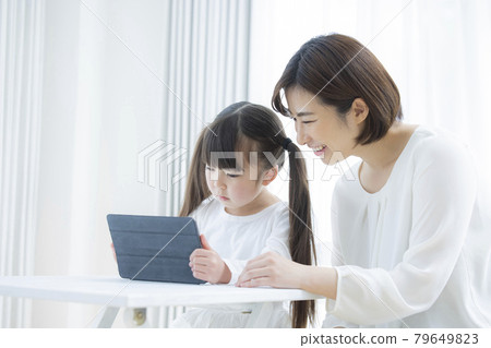 6-year-old girl and mom tablet learning 6-year-old girl and mom tablet learning 79649823