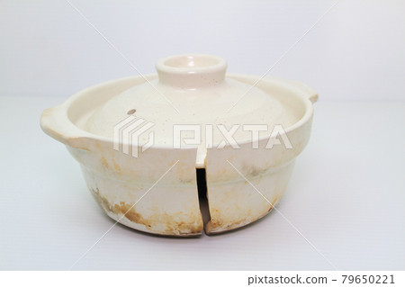 Earthenware pot split in half Earthenware pot split in half 79650221