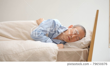 Elderly resting in the bedroom Elderly resting in the bedroom 79650876