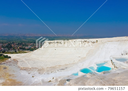 Travertines in Turkey. Calcite cliff of Pamukkale. Travertines in Turkey. Calcite cliff of Pamukkale. 79651157