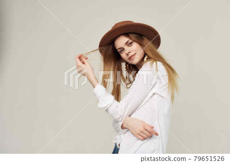 attractive woman in white shirt wearing hat decoration fashion modern style attractive woman in white shirt wearing hat decoration fashion modern style 79651526