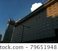 Hotels in the city center and cumulonimbus 79651948
