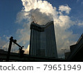 Urban buildings and summer clouds 79651949