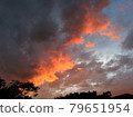 Clouds dyed orange at dusk in summer 79651954