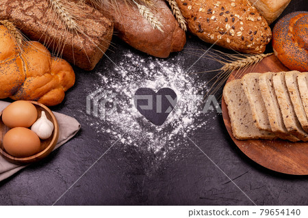 Love cooking. Various of rye bread on a dark background. Copy space. 79654140
