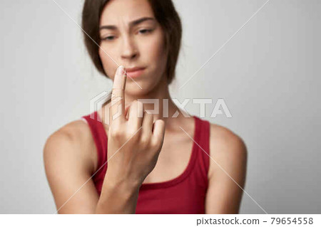 woman with injured forefinger injury medicine light background 79654558