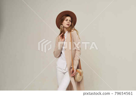 pretty woman in hat fashion posing modern style light background pretty woman in hat fashion posing modern style light background 79654561