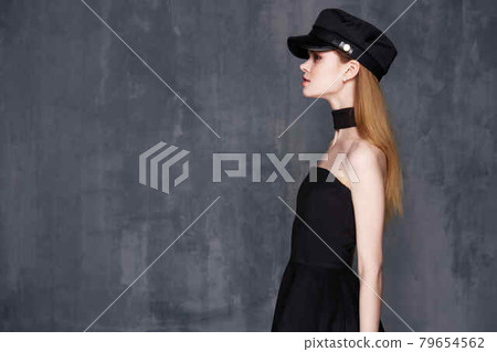pretty woman in black hat decorating home fashion clothes pretty woman in black hat decorating home fashion clothes 79654562
