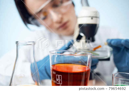 woman laboratory assistant microscope research biotechnology medicine 79654692