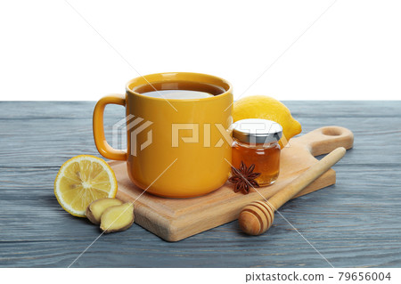 Concept of alternative cold treatment on wooden table isolated on white background Concept of alternative cold treatment on wooden table isolated on white background 79656004