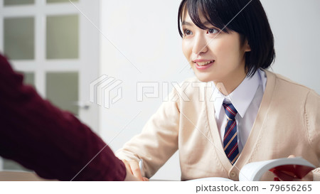 Female student receiving individual guidance Cram school tutor Female student receiving individual guidance Cram school tutor 79656265