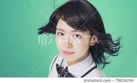 Female student with fluttering hair, high school student, examinee 79656284