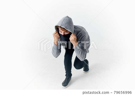 man hides his face behind a hood crime hacker caution anonymity man hides his face behind a hood crime hacker caution anonymity 79656996