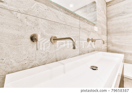 Luxury interior design of a bathroom with marble walls 79658387