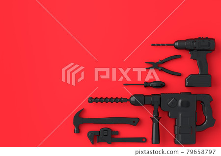 Top view of monochrome construction tools for repair on red and black 79658797