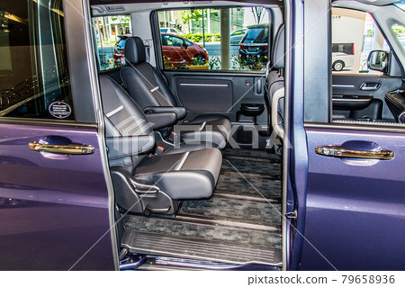 Foot space in the back seat of a minivan Foot space in the back seat of a minivan 79658936