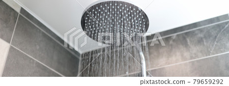 In bathroom, water flows from shower tap In bathroom, water flows from shower tap 79659292