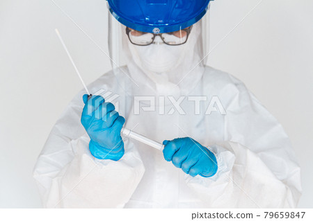 Female doctor or nurse in protective suit takes a specimen swab Female doctor or nurse in protective suit takes a specimen swab 79659847