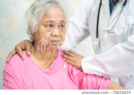 Asian nurse physiotherapist doctor touching Asian senior or elderly old lady woman patient with love, care, helping, encourage and empathy at nursing hospital ward, healthy strong medical concept. 79659874