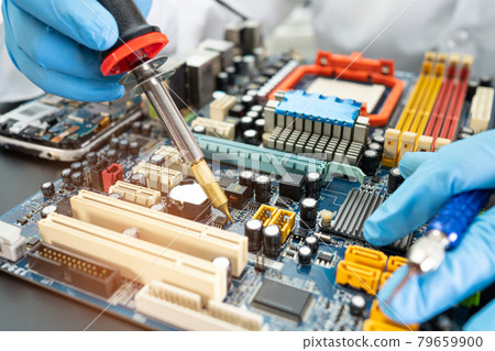 technician repairing inside of hard disk by soldering iron. Integrated Circuit. the concept of data, hardware, technician and technology. technician repairing inside of hard disk by soldering iron. Integrated Circuit. the concept of data, hardware, technician and technology. 79659900