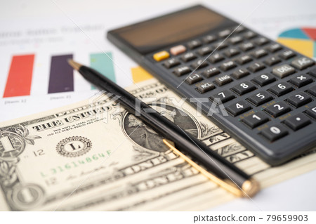 Pen and calculator on chart or graph paper. Financial, account, statistics and business data concept. 79659903