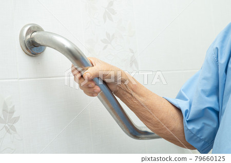 Asian senior or elderly old lady woman patient use toilet bathroom handle security in nursing hospital ward, healthy strong medical concept. 79660125
