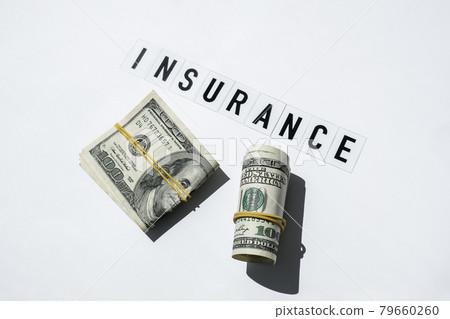Text INSURANCE around US dollar banknotes. Health, life, home, car Insurance. Insurance business concept. Health care or medicare insurance and vaccination costs. Financial crisis. Covid-19 crimes 79660260