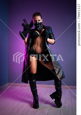 sexy female killer in underwear and a leather raincoat and long leather shoes with an m16 automatic rifle with a telescopic sight sexy female killer in underwear and a leather raincoat and long leather shoes with an m16 automatic rifle with a telescopic sight 79661317