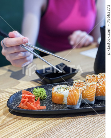 Eating roll sushi Eating roll sushi 79662272