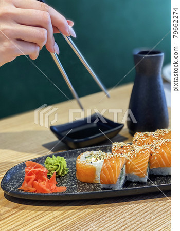 Eating roll sushi Eating roll sushi 79662274