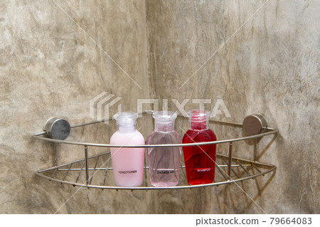 White towels with soap on a rack in the bathroom. White towels with soap on a rack in the bathroom. 79664083