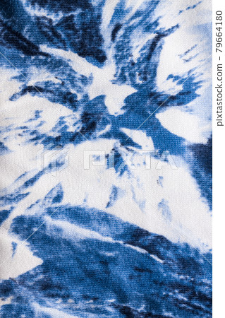 Tie-dye cotton fabric texture blue and white paint colors. Ancient resist-dyeing textile coloring technique,trendy cloth Tie-dye cotton fabric texture blue and white paint colors. Ancient resist-dyeing textile coloring technique,trendy cloth 79664180