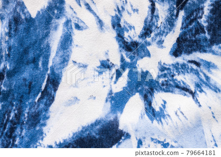 Tie-dye cotton fabric texture blue and white paint colors. Ancient resist-dyeing textile coloring technique,trendy cloth Tie-dye cotton fabric texture blue and white paint colors. Ancient resist-dyeing textile coloring technique,trendy cloth 79664181