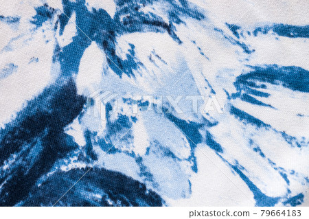 Tie-dye cotton fabric texture blue and white paint colors. Ancient resist-dyeing textile coloring technique,trendy cloth Tie-dye cotton fabric texture blue and white paint colors. Ancient resist-dyeing textile coloring technique,trendy cloth 79664183